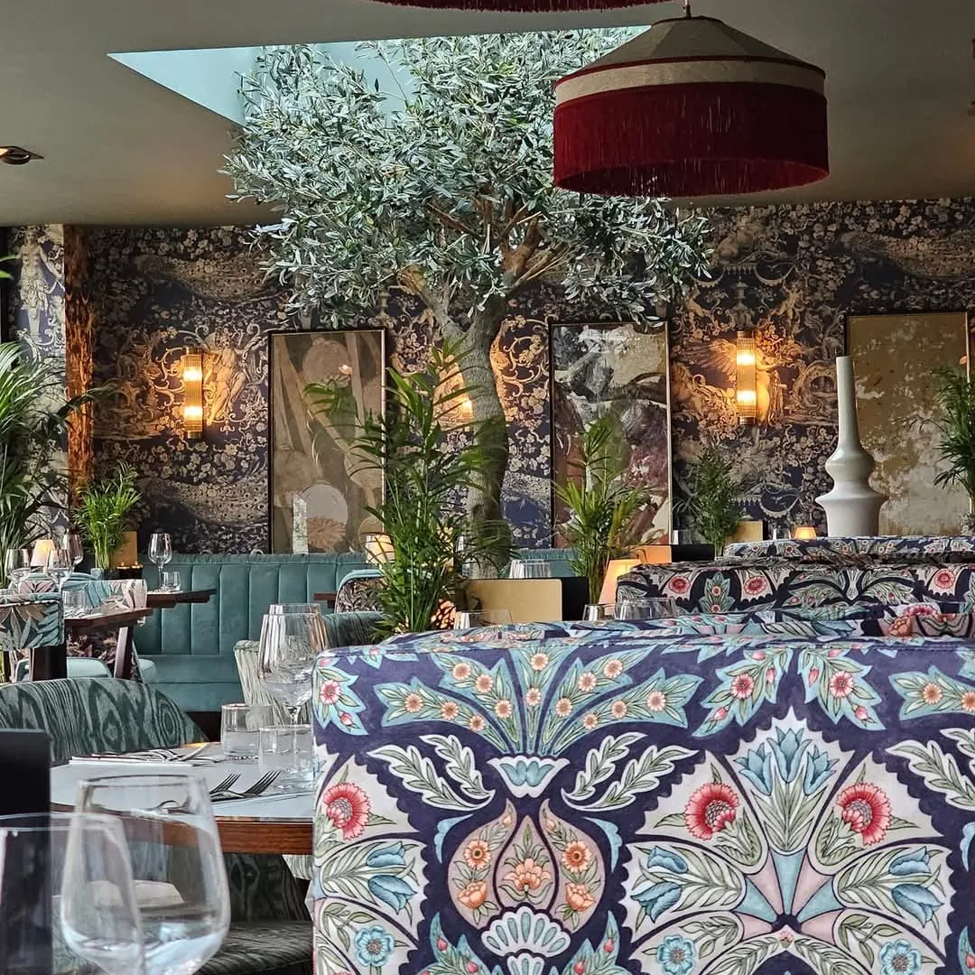 Patterned booths and red lampshades in the restaurant